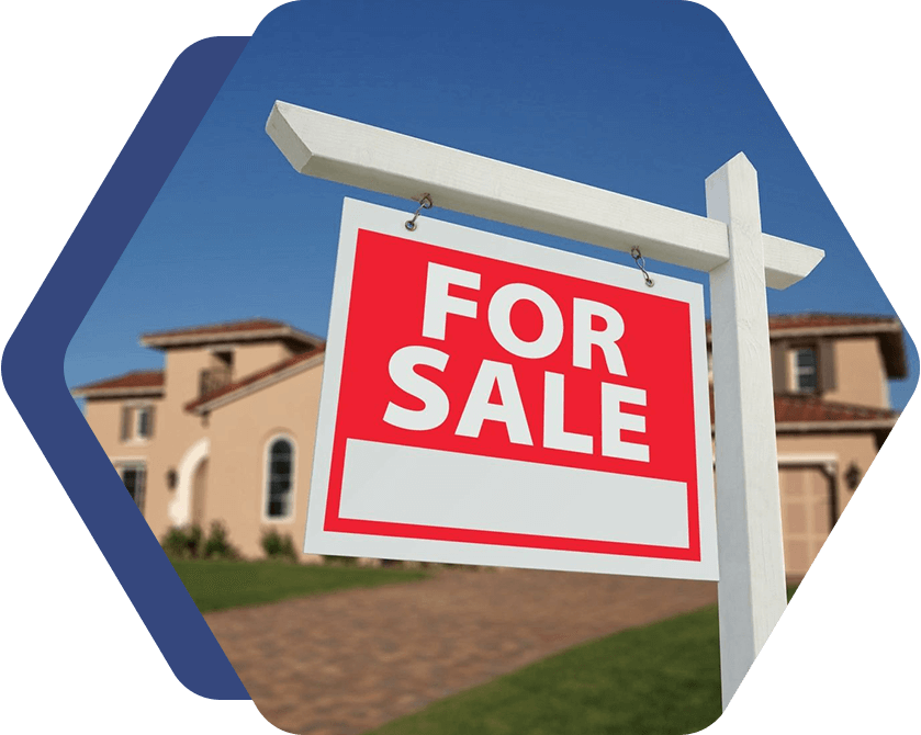 A for sale sign in front of a house.