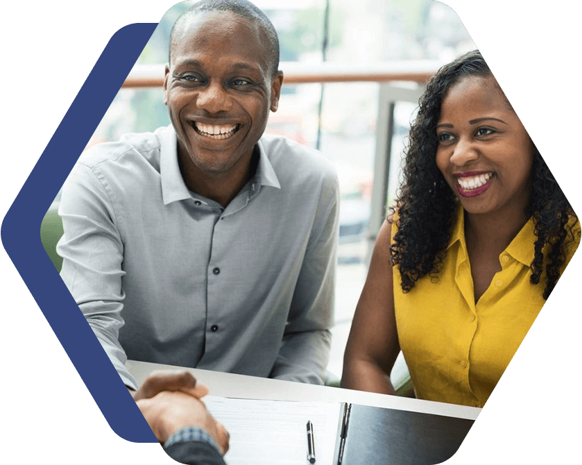 A man and woman smiling for the camera.